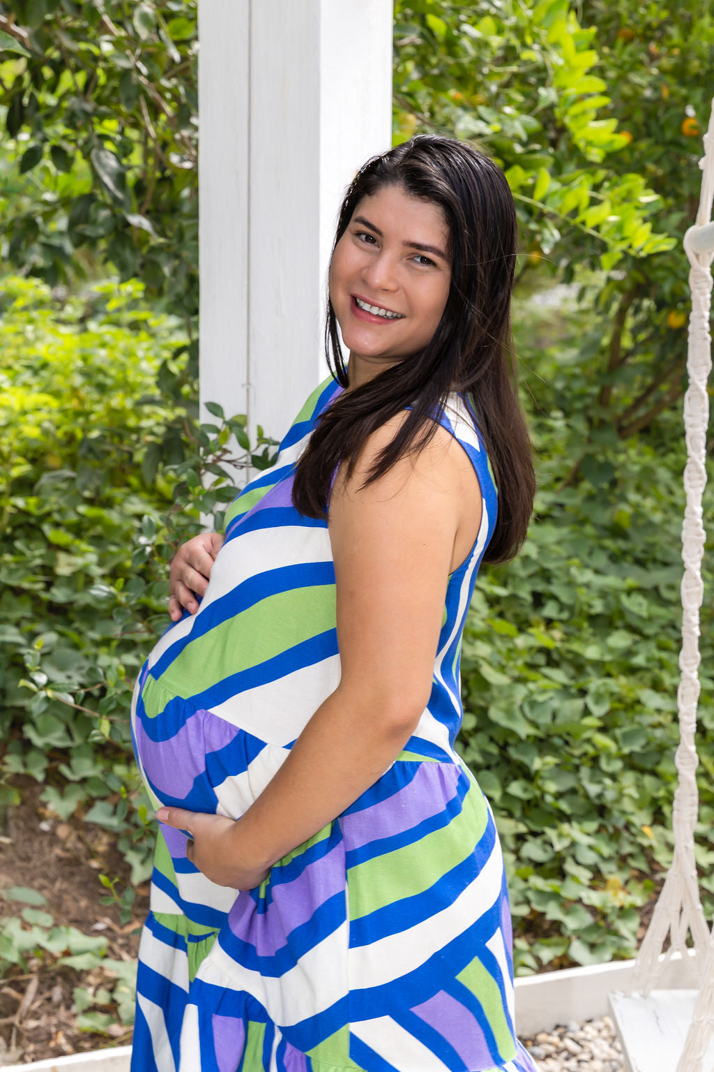 Pregnant woman wearing Harper Dress - Purple Stripe